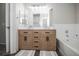 Double vanity bathroom with soaking tub and modern fixtures at 6436 Silver Mesa Dr # E, Highlands Ranch, CO 80130