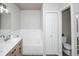 Bathroom boasts double sinks, tub, and separate toilet at 6436 Silver Mesa Dr # E, Highlands Ranch, CO 80130