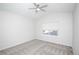 Bright bedroom with ceiling fan and neutral carpeting at 6436 Silver Mesa Dr # E, Highlands Ranch, CO 80130