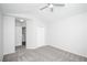 Spacious bedroom with ensuite bathroom access and ceiling fan at 6436 Silver Mesa Dr # E, Highlands Ranch, CO 80130