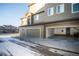 Attached garage with exterior access and driveway at 6436 Silver Mesa Dr # E, Highlands Ranch, CO 80130
