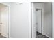 Bright hallway with doors to bedrooms and other rooms at 6436 Silver Mesa Dr # E, Highlands Ranch, CO 80130