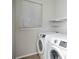 Bright laundry room with washer and dryer included at 6436 Silver Mesa Dr # E, Highlands Ranch, CO 80130