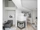 Bright living room with fireplace and hardwood floors at 6436 Silver Mesa Dr # E, Highlands Ranch, CO 80130