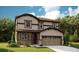 Charming two-story home with a landscaped front yard and a two-car attached garage at 1374 Lumber Ridge S Cir, Erie, CO 80516
