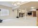 Large finished basement with a fire place, large tv, and seating area at 10375 Lions Heart, Lone Tree, CO 80124