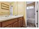Bathroom featuring a double vanity, wood cabinets, and shower and bath combo at 10375 Lions Heart, Lone Tree, CO 80124