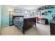 Bright bedroom with light blue walls, large windows, and a cozy workspace at 10375 Lions Heart, Lone Tree, CO 80124