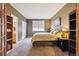 Neutral bedroom featuring ensuite bath access, a large window, and carpeted floors at 10375 Lions Heart, Lone Tree, CO 80124