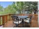 Outdoor deck featuring patio seating with a wrought iron table and chairs at 10375 Lions Heart, Lone Tree, CO 80124