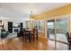 Open dining area with wood floors and sliding glass doors to outdoor deck at 10375 Lions Heart, Lone Tree, CO 80124