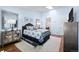 Sunlit bedroom with a skylight, soft rug, and a decorative mirror adds charm to the space at 33 Canongate Ln, Highlands Ranch, CO 80130