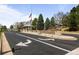 Welcoming entrance to Gleneagles Village with stone signage and manicured landscaping at 33 Canongate Ln, Highlands Ranch, CO 80130