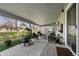 Inviting covered patio featuring comfortable seating and stylish decor, perfect for outdoor relaxation and entertaining at 33 Canongate Ln, Highlands Ranch, CO 80130