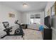 Versatile exercise room with ample light, exercise equipment and neutral carpet flooring at 33 Canongate Ln, Highlands Ranch, CO 80130
