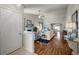 Open-concept living room with hardwood floors, a fireplace, and plenty of natural light at 33 Canongate Ln, Highlands Ranch, CO 80130