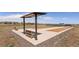 Outdoor bocce ball court with shade structure and seating at 20370 E 52Nd Ave, Denver, CO 80249