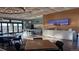 Modern clubhouse interior featuring an island, seating area, and a TV at 20370 E 52Nd Ave, Denver, CO 80249