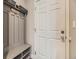 Entryway featuring coat rack with bench and shoe storage by the front door at 20370 E 52Nd Ave, Denver, CO 80249