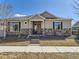 Charming single-story home with stone accents, neutral siding, and covered porch at 20370 E 52Nd Ave, Denver, CO 80249