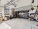 Spacious garage with epoxy flooring and lots of storage and bike racks at 20370 E 52Nd Ave, Denver, CO 80249