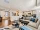 Comfortable living room leading to a modern kitchen, offering open concept living at 20370 E 52Nd Ave, Denver, CO 80249