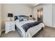 Well-lit main bedroom featuring neutral colors and a walk-in closet with access to bathroom at 20370 E 52Nd Ave, Denver, CO 80249