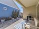 Inviting outdoor patio with pavers, landscaping, seating, and a grill setup at 20370 E 52Nd Ave, Denver, CO 80249