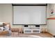 Home theater featuring a large projector screen, comfortable seating, and integrated sound system at 7192 Pinewood Dr, Evergreen, CO 80439