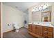 Bright bathroom featuring a wooden vanity, a shower, and ample space at 7192 Pinewood Dr, Evergreen, CO 80439