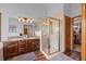 Spacious bathroom with double vanity and a glass enclosed shower at 7192 Pinewood Dr, Evergreen, CO 80439
