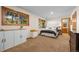 Spacious bedroom with built-in storage, large windows, and stylish decor at 7192 Pinewood Dr, Evergreen, CO 80439