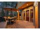 Outdoor deck with table and chairs at 7192 Pinewood Dr, Evergreen, CO 80439