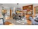 Elegant dining room featuring a fireplace, built-in shelving, and comfortable seating at 7192 Pinewood Dr, Evergreen, CO 80439