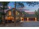 Stunning multi-story home with a three-car garage nestled in a wooded landscape with a deck at 7192 Pinewood Dr, Evergreen, CO 80439