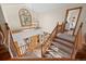 Bright foyer with staircase and modern light fixture at 7192 Pinewood Dr, Evergreen, CO 80439