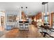 Bright kitchen with bar seating, dining area, and access to outdoor deck, great for entertaining at 7192 Pinewood Dr, Evergreen, CO 80439