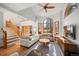 Bright living room with vaulted ceilings, expansive windows, and hardwood floors at 7192 Pinewood Dr, Evergreen, CO 80439