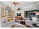 Bright living room with vaulted ceilings, expansive windows, and hardwood floors at 7192 Pinewood Dr, Evergreen, CO 80439