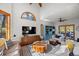 Bright living room with vaulted ceilings, expansive windows, and hardwood floors at 7192 Pinewood Dr, Evergreen, CO 80439