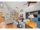 Bright and airy living room with large windows, hardwood floors, and vaulted ceilings at 7192 Pinewood Dr, Evergreen, CO 80439