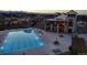 Aerial view of the community pool showcasing its size, the surrounding lounge area, and neighborhood at 8503 Estes Park Ave, Littleton, CO 80125