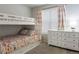 Bedroom with a bunk bed and dresser at 8503 Estes Park Ave, Littleton, CO 80125