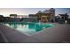 Stunning community pool with a modern clubhouse featuring a large pool and lounge chairs for residents at 8503 Estes Park Ave, Littleton, CO 80125