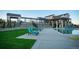 The community pool has several lounge chairs available, and lush green grass provides a relaxing spot at 8503 Estes Park Ave, Littleton, CO 80125