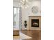 Cozy fireplace with a tiled surround, complemented by modern decor and stylish window coverings at 8503 Estes Park Ave, Littleton, CO 80125