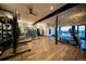 Modern fitness center featuring state-of-the-art equipment and a view of the community pool at 8503 Estes Park Ave, Littleton, CO 80125