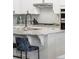 Granite countertops, stainless steel appliances, and a gas cooktop in the modern kitchen at 8503 Estes Park Ave, Littleton, CO 80125
