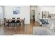 Open floor plan featuring a dining area and modern kitchen at 8503 Estes Park Ave, Littleton, CO 80125