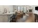 Inviting living area with a cozy fireplace, hardwood floors, and seamless flow from the kitchen at 8503 Estes Park Ave, Littleton, CO 80125